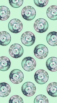 Many used spray cans for graffiti drawing lies on a pastel colored backgroung. Street art painting concept. Minimal flat lay pattern. Top view photo