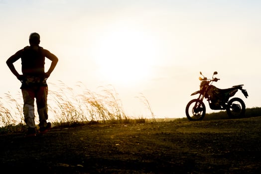 man with motocross beautiful light mountain independent adventure tourism concept photo