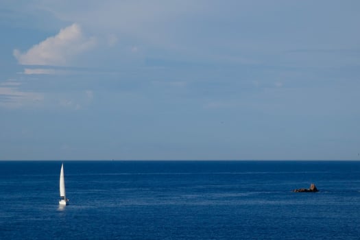 Sailboat sailing in the mediterranean sea, calm waters photo
