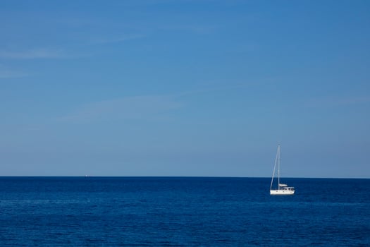 Sailboat sailing in the mediterranean sea, calm waters photo