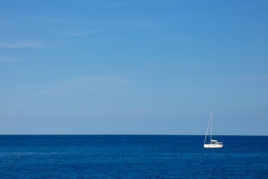 Sailboat sailing in the mediterranean sea, calm waters photo