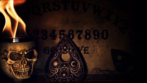 Ouija Witch Board and Skull Head on Fire photo