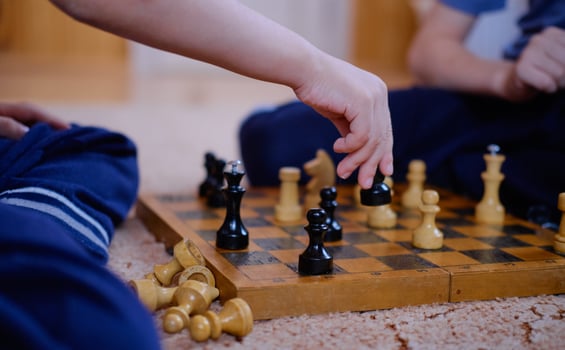 child playing chess close up photo