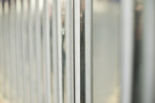 Steel fence in detail. Fence made of metal profile. Durable material to protect against prying eyes. photo