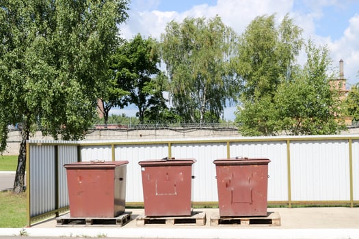Three large industrial brown dustbin, trash for separate garbage collection in an industrial plant photo
