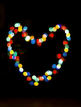 Bokeh with the shape of a heart with multi colors photo