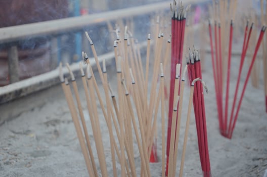 Burning aroma incense sticks in the incense burner. Incense for praying Buddha or Hindu gods to show worship. photo