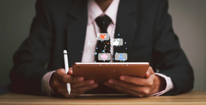 Concept with notification icons of like being happyand social media interactions on mobile phone,message, email, comment ,businessman hands holding device photo