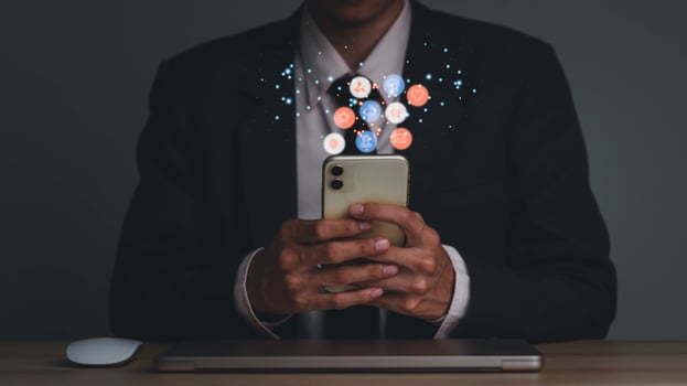 Concept with notification icons of like being happyand social media interactions on mobile phone,message, email, comment ,businessman hands holding device photo