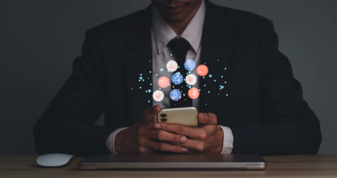 Concept with notification icons of like being happyand social media interactions on mobile phone,message, email, comment ,businessman hands holding device photo