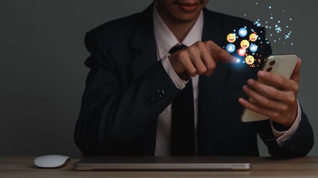 Concept with notification icons of like being happyand social media interactions on mobile phone,message, email, comment ,businessman hands holding device photo