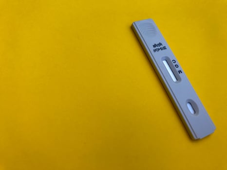 medical procedures. coronavirus test on a bright yellow background. new home self-diagnosis kit. sensitive test strip for taking blood and determining antibodies photo