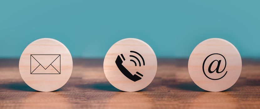 Customer Contact Us Service with Mail, Email, Telephone icons on the circle wooden  put on the desk. photo