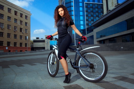 adorable sports woman on bicycle photo