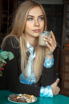 beautiful girl drinks coffee photo