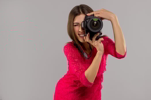 Brunette woman with photo camera