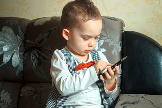 little boy with mobile phone photo