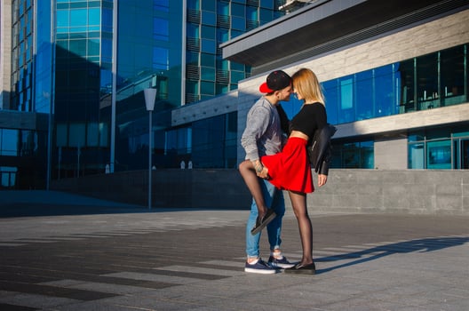 young couple outdoors hugging photo