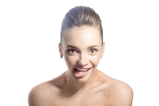 Happy young girl with brown eyes in studio photo