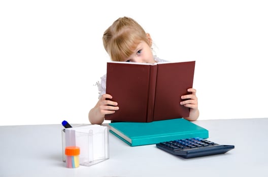 young schoolgirl with book in her hands photo