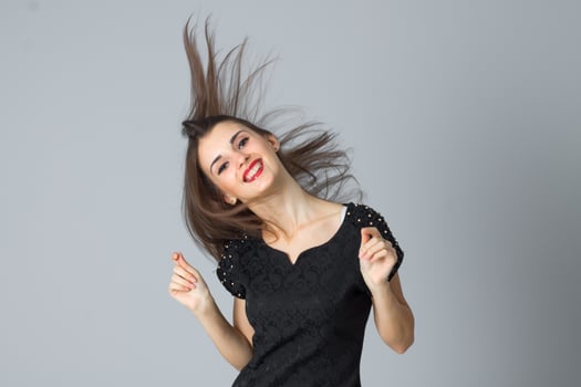 girl in black dress posing in studio photo