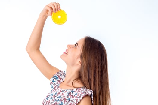 girl with orange slices in hands photo