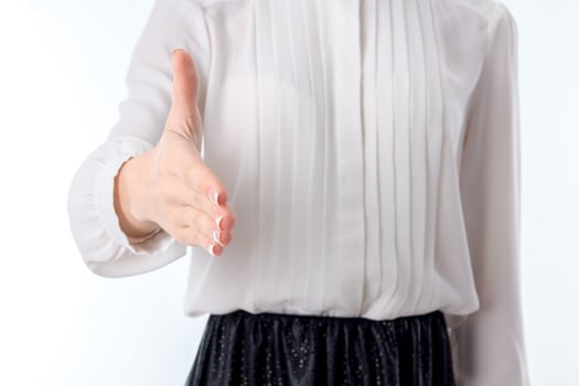 girl in white shirt stands up straight and stretch forward hand closeup photo