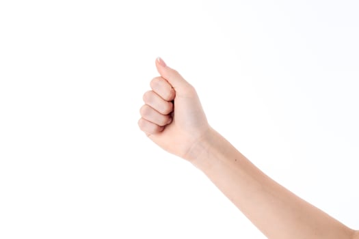 female hand outstretched forward with bent fingers isolated on white background photo