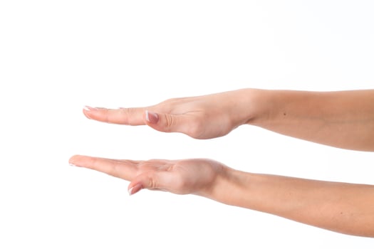 two female hands with expanded towards each other  palms is isolated on a white background photo