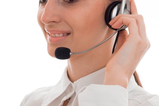 girl holding hand headphones with microphone and smiling photo