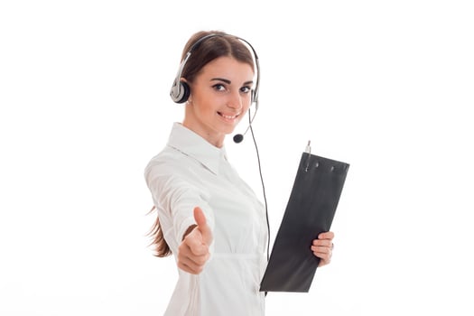 young girl in white shirt and headset holding a Tablet for papers and shows gesture class photo