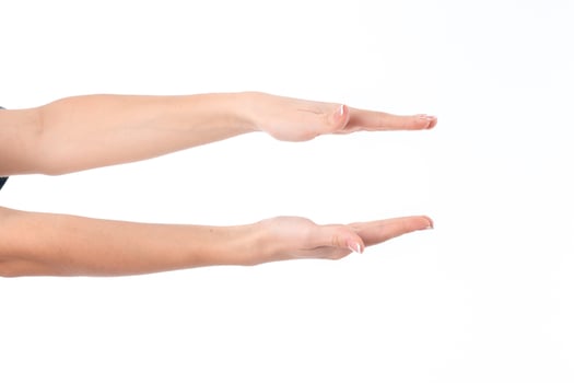 two female hands outstretched toward the one opposite the other isolated on white background photo