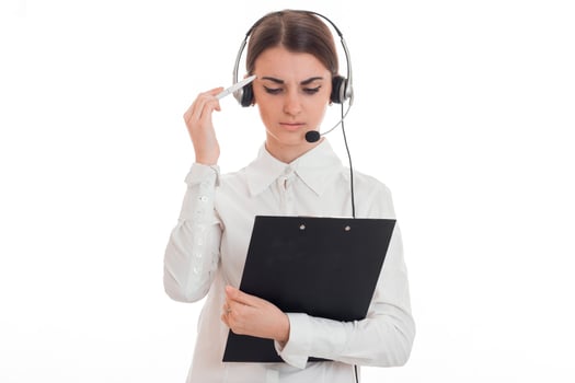 young girl in headphones lowered her head and holding a black Tablet photo