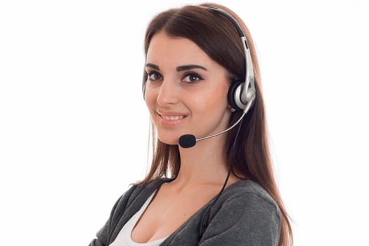 cutie young brunette business woman with headphones and microphone posing isolated on white background photo