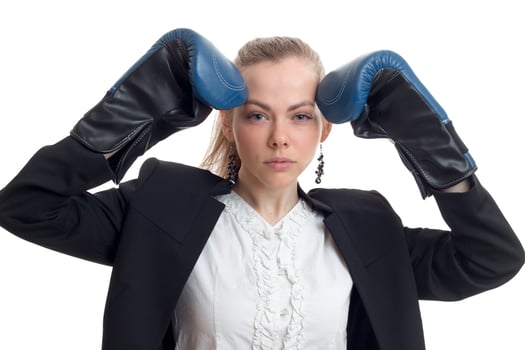 beautiful sexy blonde in jacket raised up hands in boxing gloves close-up photo
