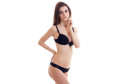 young sexy wonderful beautiful girl in black lingerie posing on camera photo