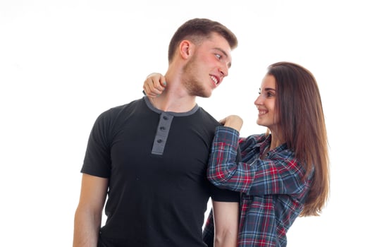 fun romantic couple standing near and stare at each other close-up photo