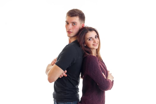 smiling pin-up girl is standing next to a high cute guy back to back photo