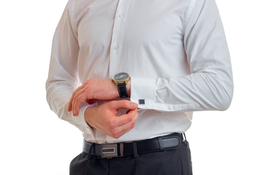 a young guy in a white shirt put on hand watch close-up photo