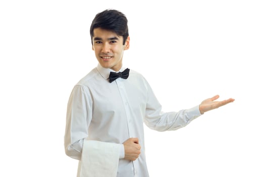 young friendly waiter smiles and stretches toward the hand photo