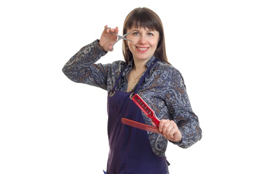 beautiful woman stylist with tools in the hands smiling at camera photo