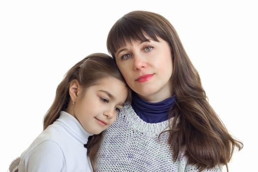 Portrait of mother and daughter cuddling photo
