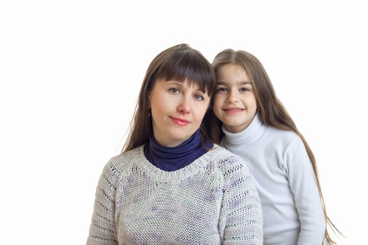 mother with her daughter hugs and smiles on camera photo