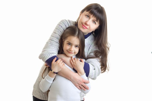 young mother hugs her little arm and cute daughter photo
