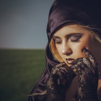 pretty young blonde with closed eyes in the hood photo