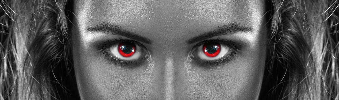 black and white photo of girl with red eyes