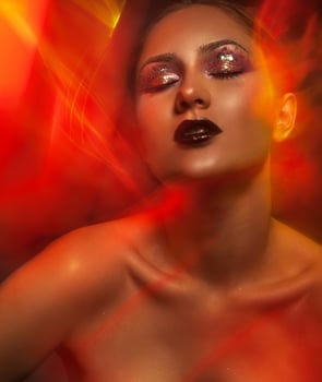 valuptuous portrait of beauty woman with red lights photo