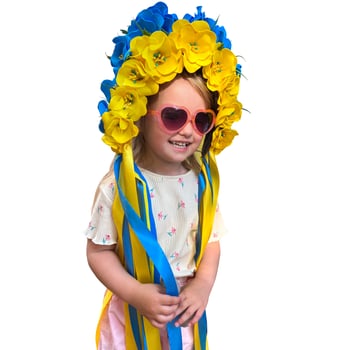 Happpy girl posing on camera with blue and yellow wreast photo