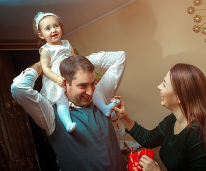 Happy family play with little baby girl at home photo