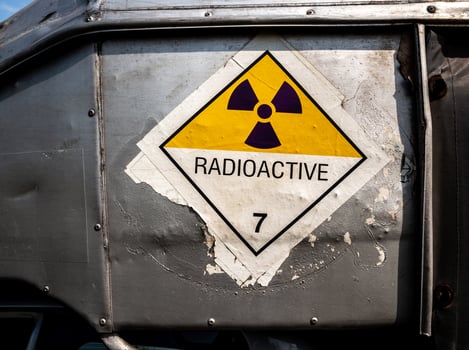 Radiation warning sign on the Dangerous goods transport label Class 7 at the side transport truck photo